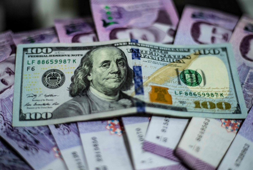 عودة الدولارات السورية من الخارج من شأنها تحسين سعر الصرف (أ ف ب )